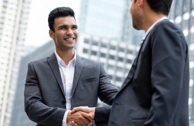 young-smiling-indian-businessman-making-260nw-1390951934